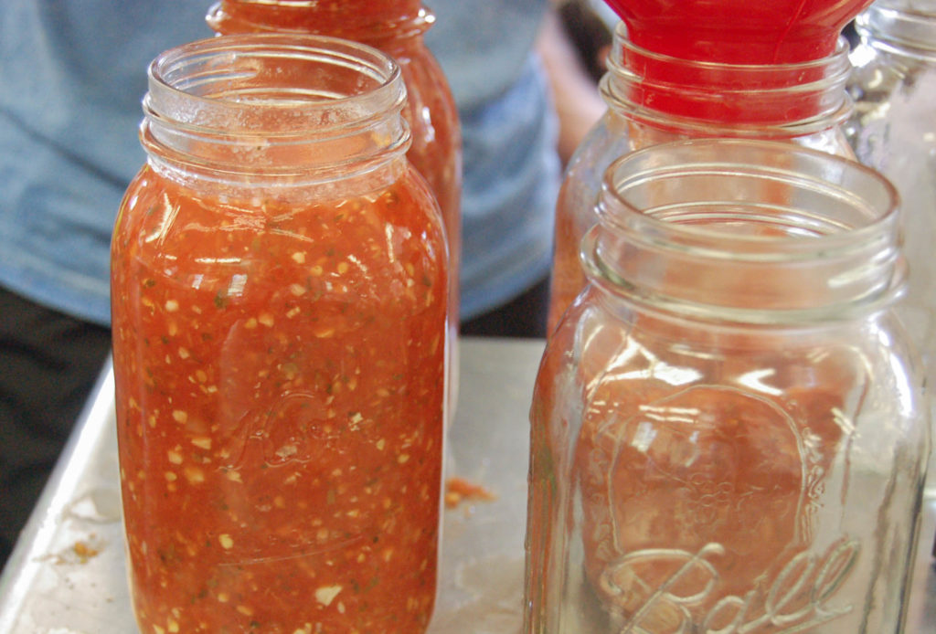 The almost-finished salsa in jars. 